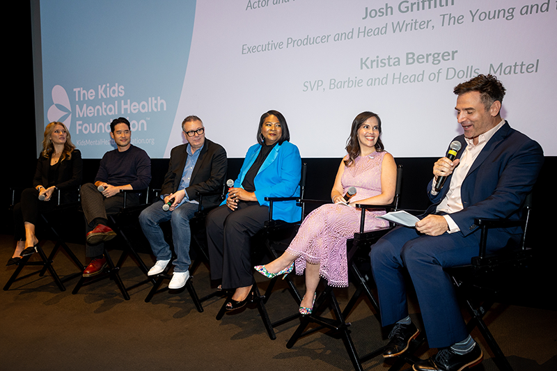 People sitting and talking about mental health on a panel